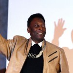 Brazilian soccer legend Pele poses for picture after receiving an Olympic necklace from President of the International Olympic Committee (IOC) Thomas Bach at the Pele Museum in Santos, Brazil June 16, 2016.  REUTERS/Paulo Whitaker