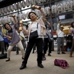 Elderly and middle-age people exercise with wooden dumbbells during a health promotion event to mark Japan's "Respect for the Aged Day" at a temple in Tokyo's Sugamo district, an area popular among the Japanese elderly, September 21, 2015. REUTERS/Issei Kato TPX IMAGES OF THE DAY