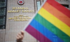 68465466_A-person-waves-a-rainbow-flag-in-front-of-Istanbul-courthouse-on-Ju